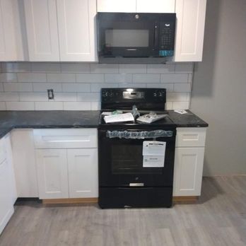 Jeannie's Remodeling and Construction - Installed cabinets, painted, did back-splash, and flooring - General Contractors Near Me