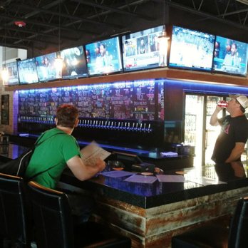 Rolling Waves Brewing and Distillery - At the bar. - Breweries Near Me - Doral, Florida Rolling Waves Brewing and Distillery - At the bar. - Breweries Near Me - Doral, Florida