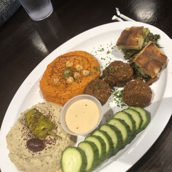 Odeh’s Mediterranean Kitchen - Middle Eastern Sampler. This had the baba ghanoush, the red pepper, hummus, cucumbers, falafel Spanakopita. (THIS WAS SOOOOOO GOOOD!!!!!) - Mediterranean Near Me - High Point, North Carolina Odeh’s Mediterranean Kitchen - Middle Eastern Sampler. This had the baba ghanoush, the red pepper, hummus, cucumbers, falafel Spanakopita. (THIS WAS SOOOOOO GOOOD!!!!!) - Mediterranean Near Me - High Point, North Carolina