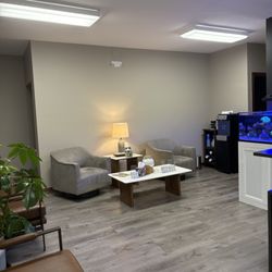 Pathways Counseling NWA - Comfortable well spaced seating. An amazing salt water aquarium and Culligan water cooler for cool or hot drinks.