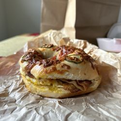 Benji's Bagel & Coffee House - Yummm. Jalapeño cheddar bagel with bacon, egg, cheese and chili schmear.