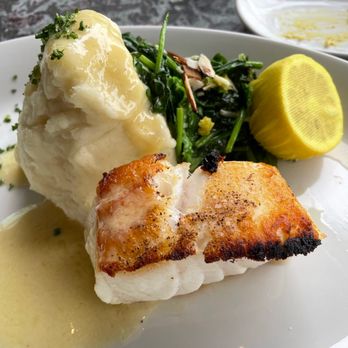 Nick's On State - Chilean Sea Bass with sautéed spinach and almonds, mashed potatoes and beurre blanc sauce - New American Near Me - Carlsbad, California Nick's On State - Chilean Sea Bass with sautéed spinach and almonds, mashed potatoes and beurre blanc sauce - New American Near Me - Carlsbad, California