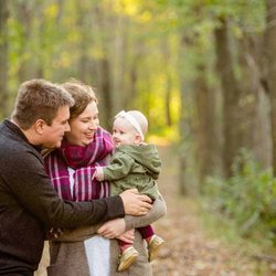 Visual Roots Photography - Newborn smiles for mom and dad in this outdoor forest session
