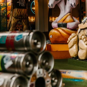 Flatstick Pub - Spokane - a display of beer cans and unicorns - Beer Bar Near Me - Spokane, Washington