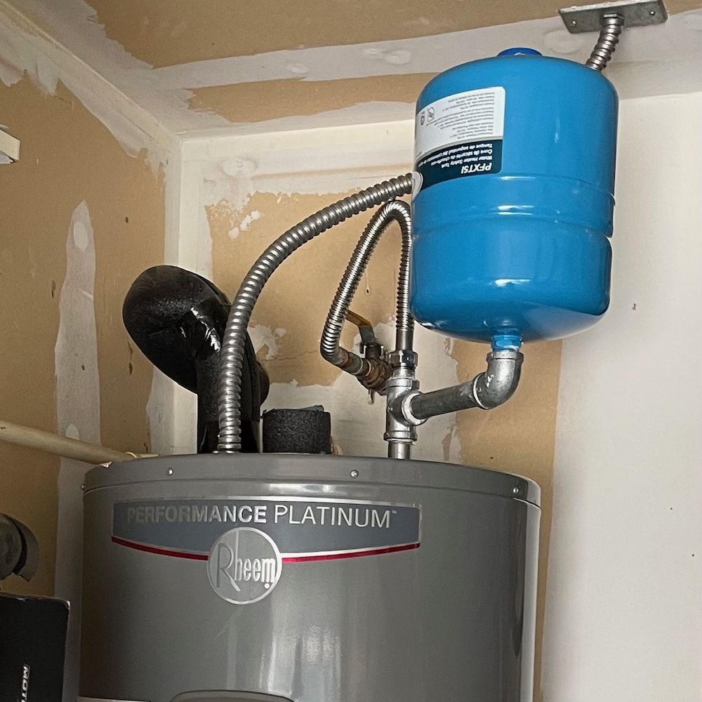 Nikki's Plumbing Company - New expansion tank over the Hot Water Heater - Plumbing Near Me - Euless, Texas Nikki's Plumbing Company - New expansion tank over the Hot Water Heater - Plumbing Near Me - Euless, Texas