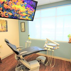 Apple Grove Dental - All rooms feature an overhead TV for your comfort