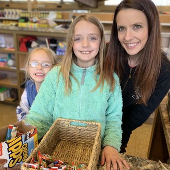 Lakeside Market - a woman and two children with a basket of candy - Grocery Near Me - Angola, New York Lakeside Market - a woman and two children with a basket of candy - Grocery Near Me - Angola, New York