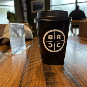 Black Rifle Coffee - Small coffee at table - Coffee Roasteries Near Me - Orange Park, Florida Black Rifle Coffee - Small coffee at table - Coffee Roasteries Near Me - Orange Park, Florida