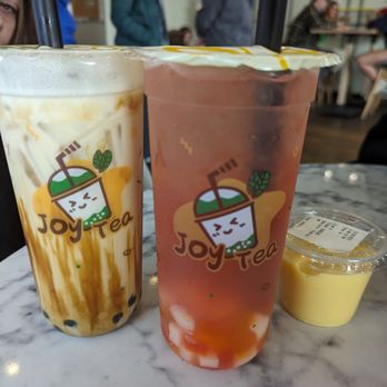 Joy Tea - Black Sugar Milk Tea and Raspberry Lychee Green tea with rainbow jelly. Egg pudding on the side! - Bubble Tea Near Me - Wichita, Kansas Joy Tea - Black Sugar Milk Tea and Raspberry Lychee Green tea with rainbow jelly. Egg pudding on the side! - Bubble Tea Near Me - Wichita, Kansas