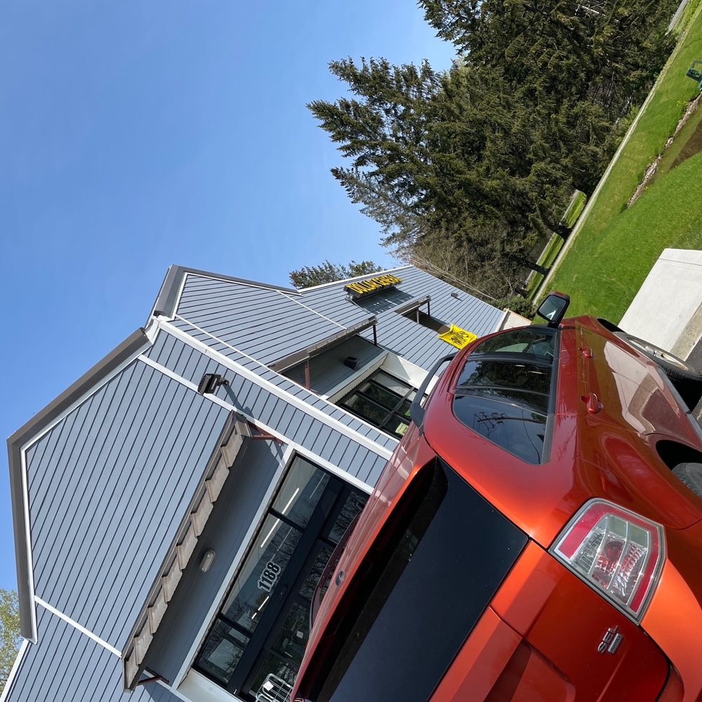 Dollar General - a red car parked in front of a house - Grocery Near Me - Locke, New York