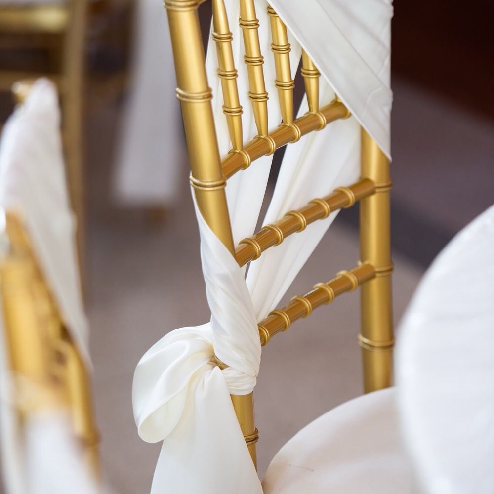 Luxe Event Linen - Gold chiavari chair with ivory sash - Party & Event Planning Near Me - Troy, Michigan