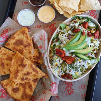 Izzo's Illegal Burrito - Cabela's - a plate of quesadillas and a bowl of salad - Mexican Near Me - Gonzales, Louisiana Izzo's Illegal Burrito - Cabela's - a plate of quesadillas and a bowl of salad - Mexican Near Me - Gonzales, Louisiana