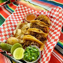 Mexican Street Tacos with grill onions, Jalapeños , small potatoes.