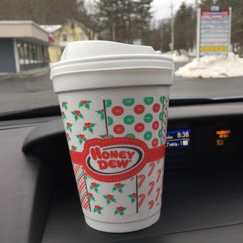 Honey Dew Donuts - a coffee cup on the dashboard of a car - Donuts Near Me - Framingham, Massachusetts