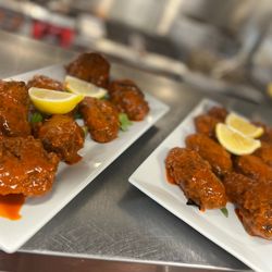 Mimosa Cafe - Whole chicken wings prepped in house tossed in spicy wing sauce.