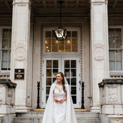 NiEl Bridal Atelier - A timeless bridal moment on grand steps, where classic elegance meets modern romance