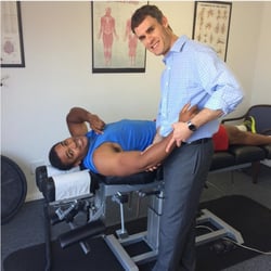 Radin Chiropractic - Treating a patient's elbow and shoulder.