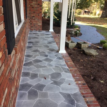 Innovative Floor Works - a stone walkway between two houses - Flooring Near Me - Piedmont, South Carolina Innovative Floor Works - a stone walkway between two houses - Flooring Near Me - Piedmont, South Carolina
