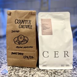 Early Bird Espresso & Mercantile - A Barista/painter's touch on the coffee bean bag on the left, including the roast date.