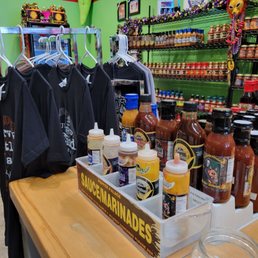a variety of hot sauces and condiments a variety of hot sauces and condiments