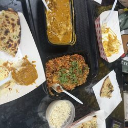 Swagat Spice Bazaar & Indian Grocery - Biryani with goat, Chicken Tikka Masala and Naan