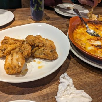 Yard House - lemon pepper wings and Miguel's queso dip - Bars Near Me - East Rutherford, New Jersey Yard House - lemon pepper wings and Miguel's queso dip - Bars Near Me - East Rutherford, New Jersey