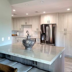 Core Kitchen Designs - San Marcos, CA. Two-tone cabinetry with quartzite counters.