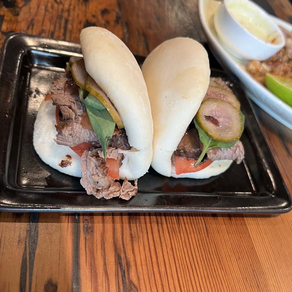 Shōjō Cambridge - two sandwiches on a black plate - Asian Fusion Near Me - Cambridge, Massachusetts Shōjō Cambridge - two sandwiches on a black plate - Asian Fusion Near Me - Cambridge, Massachusetts
