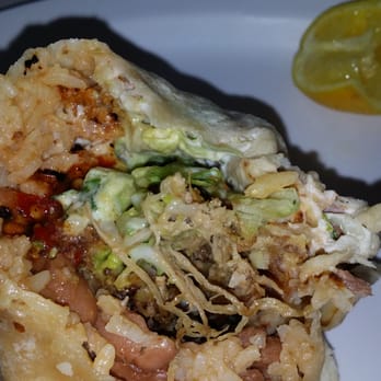 Taqueria Modesto - Carnitas with rice beans and cheese.  Salsa sour cream and chili with lime. Happy Customer. - Mexican Near Me - Modesto, California