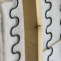 Bottom of couch was made with knotted wood. It's a build your own sectional at $400 a piece and I got 4 pieces. Buy elsewhere. Bottom of couch was made with knotted wood. It's a build your own sectional at $400 a piece and I got 4 pieces. Buy elsewhere.