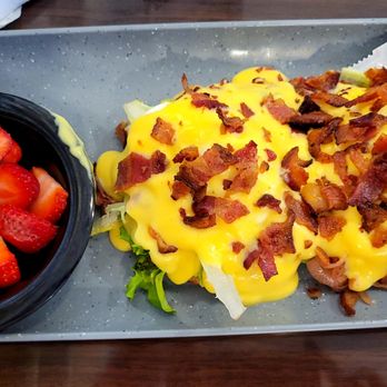 Flip’N Jacks - HIPPIE BENNY Hickory smoked bacon, avocado, sauteed onions, field greens on English muffin topped with poached eggs, hollandaise sauce - Pancakes Near Me - Ames, Iowa