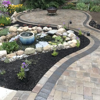 Penning Landscape Services - a garden with a fountain - Landscaping Near Me Penning Landscape Services - a garden with a fountain - Landscaping Near Me