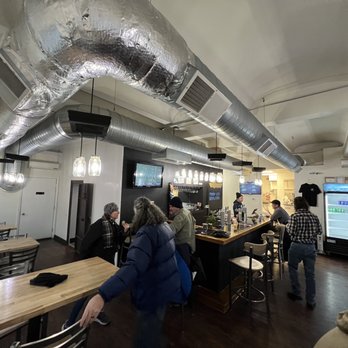 Third Life Brewing - a group of people at a bar - Breweries Near Me - Manistee, Michigan