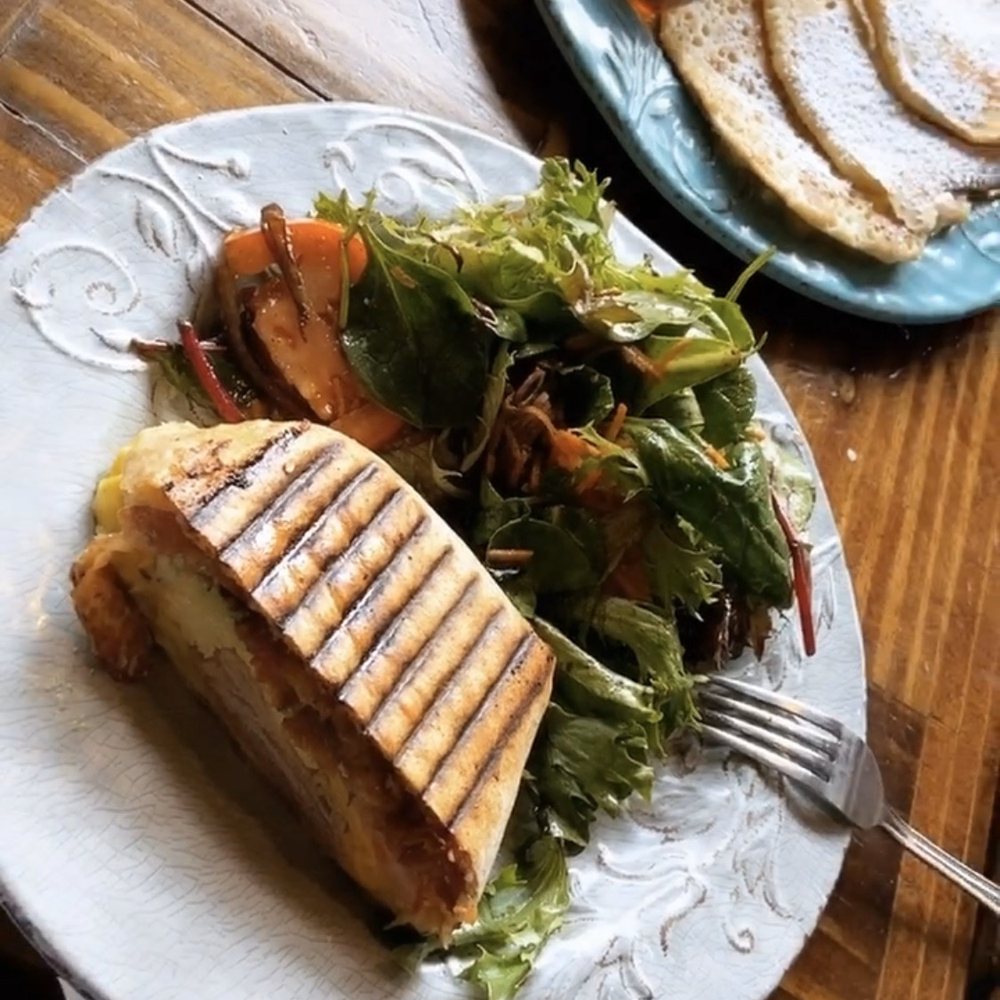 Lemoni Cafe - Breakfast wrap (only half shown here) comes with a small side salad or a bag of chips. Also ordered the pancakes to share - Breakfast & Brunch Near Me - Miami, Florida