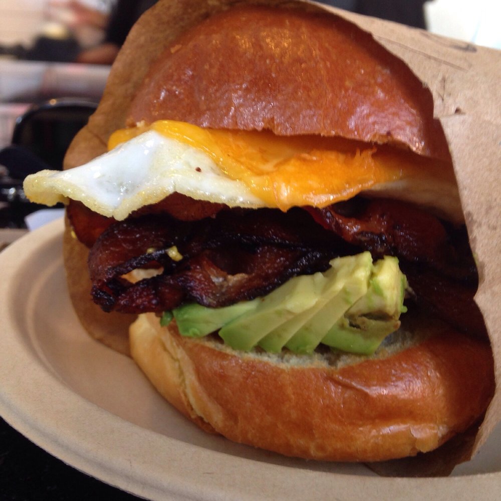 Egg cheese bacon sandwich + avocado. Cheap and worth the wait! Egg cheese bacon sandwich + avocado. Cheap and worth the wait!