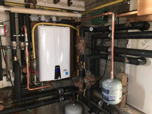 Installation of a Navian tankless water heater - Installation of a new Navian high efficiency tankless water heater. Installation of a Navian tankless water heater - Installation of a new Navian high efficiency tankless water heater.
