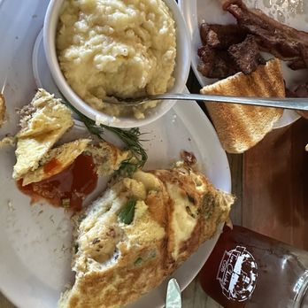 Two Chicks Cafe - Seafood omelette with creamy grits - Breakfast & Brunch Near Me - New Orleans, Louisiana Two Chicks Cafe - Seafood omelette with creamy grits - Breakfast & Brunch Near Me - New Orleans, Louisiana