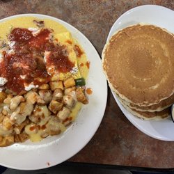 Perkins American Food - Everything Omelette smothered in Hollandaise, Salsa and Hot Sauce with Country Potatoes and Pancakes