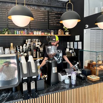 Magnifico Coffee Roasters - a man preparing a cup of coffee - Coffee & Tea Near Me - Chicago, Illinois