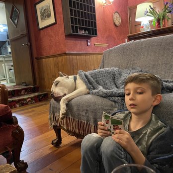 Dutch Flat Hotel - Playing cards next to fireplace with Lestat - Hotels Near Me - Dutch Flat, California