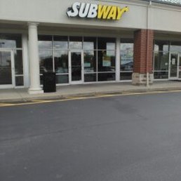 the entrance to a subway store