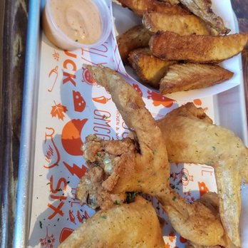 Cluck Clucks - This was my girlfriend's order. Chicken wings, wedges and a Coke - Chicken Shop Near Me - Toronto, Ontario Cluck Clucks - This was my girlfriend's order. Chicken wings, wedges and a Coke - Chicken Shop Near Me - Toronto, Ontario