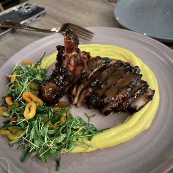 Margot - bone-in pork chop black garlic miso, corn cream, pickled chillies - Spanish Near Me - Culver City, California Margot - bone-in pork chop black garlic miso, corn cream, pickled chillies - Spanish Near Me - Culver City, California