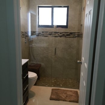 Major Tile & Marble Installation - a shower and toilet - General Contractors Near Me - Doral, Florida Major Tile & Marble Installation - a shower and toilet - General Contractors Near Me - Doral, Florida