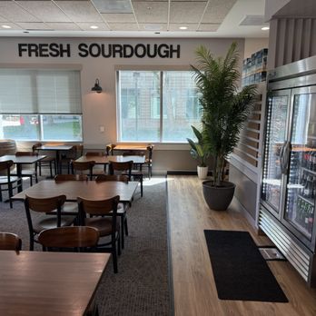 CRUST - Fresh Sourdough Deli - One  end of seating area lots of tables and space, beverage machine - Sandwiches Near Me - Pleasanton, California