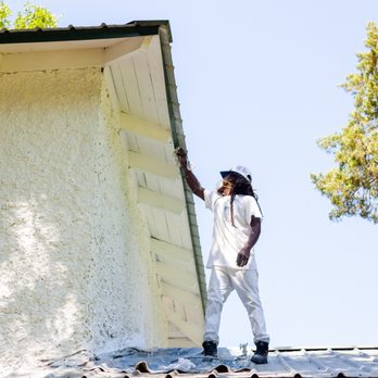 Marion's Painting Contractors - a man painting a house - Painters Near Me Marion's Painting Contractors - a man painting a house - Painters Near Me