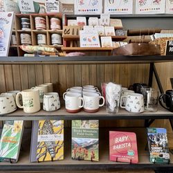 Plume Coffee Bar - Branded mugs and books etc. for sale