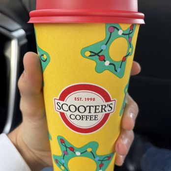 Scooter's Coffee - a person holding a cup of coffee - Coffee & Tea Near Me - White House, Tennessee Scooter's Coffee - a person holding a cup of coffee - Coffee & Tea Near Me - White House, Tennessee