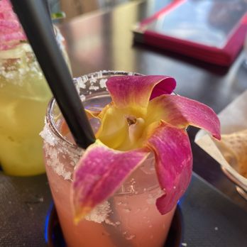 Cantina 52 - a close up of a drink with a flower in it - Dance Clubs Near Me - Crystal Lake, Illinois