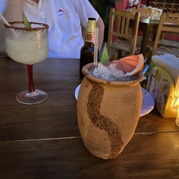 Drinks.  I don't know what it was called.  The bottom of the menu.  Tequila with several juices.  Delicious and refreshing!